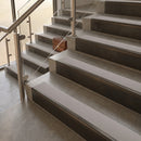 Antique Bronze finish with Light Grey Smooth Textured insert - 59.5mm solid brass raked front single channel stair nosing fitted to a stone step