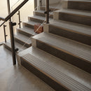Antique Bronze finish with Light Grey Castellated insert - 59.5mm solid brass raked front single channel stair nosing fitted to a stone step