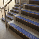Antique Bronze finish with Mid Blue Castellated insert - 59.5mm solid brass raked front single channel stair nosing fitted to a stone step