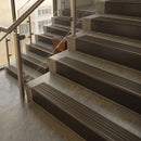 Antique Bronze finish with Olive Castellated insert - 59.5mm solid brass raked front single channel stair nosing fitted to a stone step