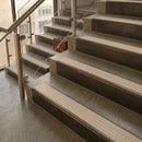 Antique Bronze finish with Porth Stone Castellated insert - 59.5mm solid brass raked front single channel stair nosing fitted to a stone step