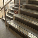 Antique Bronze finish with Polished Brass insert - 59.5mm solid brass raked front single channel stair nosing fitted to a stone step