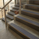 Antique Bronze finish with Regency Castellated insert - 59.5mm solid brass raked front single channel stair nosing fitted to a stone step