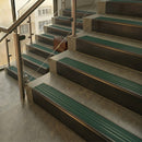 Antique Bronze finish with Spruce Castellated insert - 59.5mm solid brass raked front single channel stair nosing fitted to a stone step