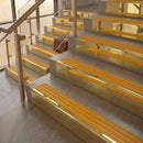 Polished Brass finish with Gold Castellated insert - 59.5mm solid brass raked front single channel stair nosing fitted to a stone step