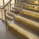 Polished Brass finish with Ivory Castellated insert - 59.5mm solid brass raked front single channel stair nosing fitted to a stone step