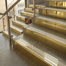 Polished Brass finish with Polar Grey Castellated insert - 59.5mm solid brass raked front single channel stair nosing fitted to a stone step