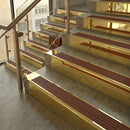 Polished Brass finish with Rustic Castellated insert - 59.5mm solid brass raked front single channel stair nosing fitted to a stone step