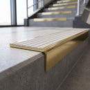 Solid Brass Stair Nosing 59.5mm Square Front with Single Channel in polished brass finish fitted on a step edge