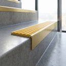 Solid Brass Stair Nosing 59.5mm Square Front with Single Channel in satin brass finish fitted on a step edge