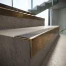 Solid Brass Stair Nosing 59.5mm Tread Raked Front Single Channel in antique bronze finish fitted on a step edge