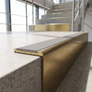 Solid Brass Stair Nosing 59.5mm Tread Square Front Profile in antique brass finish fitted on a step edge