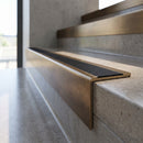 Solid Brass Stair Nosing 59.5mm Tread Square Front Profile in antique bronze finish fitted on a step edge