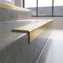 Solid Brass Stair Nosing 59.5mm Tread Square Front Profile in satin brass finish fitted on a step edge