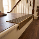 Solid brass stair nosing 59mm raked back slimline in antique brass finish with antique bronze anti-slip insert, fitted to a stair tread