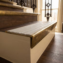 Solid brass stair nosing 59mm raked back slimline in antique brass finish with cloud castellated anti-slip insert, fitted to a stair tread