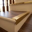 Solid brass stair nosing 59mm raked back slimline in antique brass finish with polished brass anti-slip insert, fitted to a stair tread