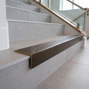 Solid brass stair nosing 59mm raked back slimline in antique bronze finish with antique bronze anti-slip insert, fitted to a stair tread