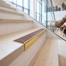 Solid brass stair nosing 59mm raked back slimline in polished brass finish with claret castellated anti-slip insert, fitted to a stair tread