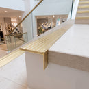 Solid brass stair nosing 59mm raked back slimline in polished brass finish with satin brass anti-slip insert, fitted to a stair tread