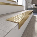Solid brass stair nosing 59mm raked back slimline in satin brass finish with polished brass anti-slip insert, fitted to a stair tread