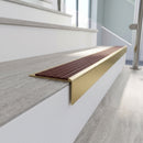 Solid brass stair nosing 59mm raked back slimline in satin brass finish with rustic castellated anti-slip insert, fitted to a stair tread