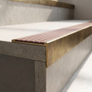 Solid Brass Stair Nosing 59mm Slimline Profile with Infill in antique brass finish fitted on a step edge