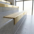 Solid Brass Stair Nosing 59mm Tread Raked Back Profile in polished brass finish fitted on a step edge