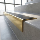 Solid Brass Stair Nosing 60mm Tread Raked Back Single Channel in polished brass finish fitted on a step edge