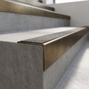 Solid Brass Stair Nosing 60mm Tread Square Front Single Channel in antique bronze finish fitted on a step edge