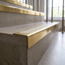 Solid Brass Stair Nosing 60mm Tread Square Front Single Channel in polished brass finish fitted on a step edge
