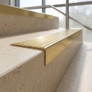 Solid Brass Stair Nosing 60mm Tread Square Front Single Channel in satin brass finish fitted on a step edge