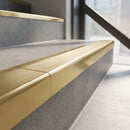 Solid Brass Stair Nosing 62mm Ribbed Tread Raked Back in polished brass finish fitted on a step edge