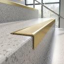 Solid Brass Stair Nosing 62mm Ribbed Tread Raked Back in satin brass finish fitted on a step edge