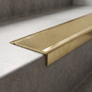 Solid Brass Stair Nosing 62mm Ribbed Tread Ramped Back in polished brass finish fitted on a step edge