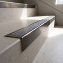 Solid Brass Stair Nosing 62mm Ribbed Tread Ramped Edge in antique brass finish fitted on a step edge