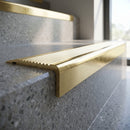 Solid Brass Stair Nosing 62mm Ribbed Tread Square Front in polished brass finish fitted on a step edge