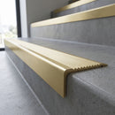 Solid Brass Stair Nosing 62mm Ribbed Tread Square Front in satin brass finish fitted on a step edge