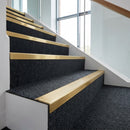 Solid Brass Stair Nosing 62mm Ribbed Tread with Ramped Back fitted on a commercial staircase
