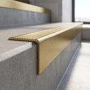 Solid Brass Stair Nosing 62mm Tread Raked Front Profile in satin brass finish fitted on a step edge