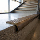 Solid Brass Stair Nosing 67.2mm Bullnose Profile with Infill in antique bronze finish fitted on a step edge