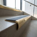 Solid Brass Stair Nosing 67.2mm Bullnose Profile with Infill in satin brass finish fitted on a step edge