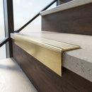 Solid Brass Stair Nosing 67mm Ribbed Tread Raked Front in satin brass finish fitted on a step edge