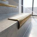 Solid Brass Stair Nosing 69.5mm Tread Bullnose Profile in antique brass finish fitted on a step edge