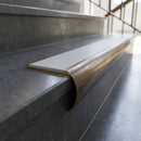 Solid Brass Stair Nosing 69.5mm Tread Bullnose Profile in antique bronze finish fitted on a step edge