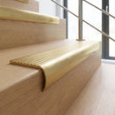 Solid Brass Stair Nosing 69.5mm Tread Bullnose Profile in satin brass finish fitted on a step edge