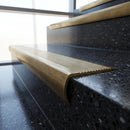 Solid Brass Stair Nosing 69mm Ribbed Bullnose with Ramped Edge in antique brass finish fitted on a step edge