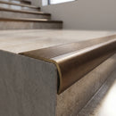Solid Brass Stair Nosing 69mm Ribbed Bullnose with Ramped Edge in antique bronze finish fitted on a step edge