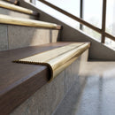 Solid Brass Stair Nosing 69mm Ribbed Bullnose with Ramped Edge in polished brass finish fitted on a step edge