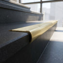 Solid Brass Stair Nosing 69mm Ribbed Bullnose with Ramped Edge in satin brass finish fitted on a step edge